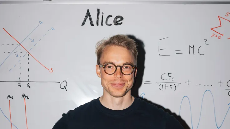 Kim Rants in front of a whiteboard with a valuation formula