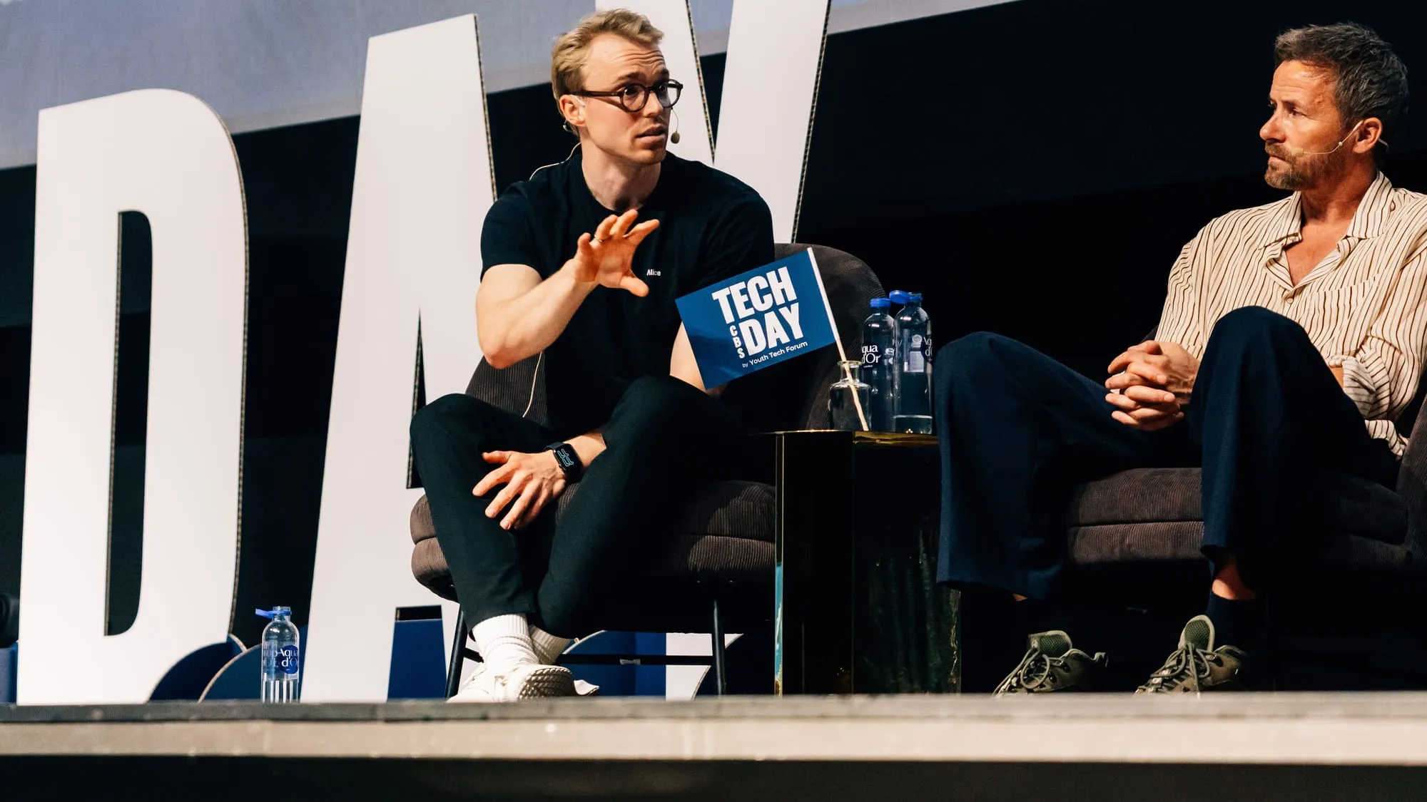 Kim Rants speaking on stage at Tech Day